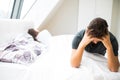 unhappy young heterosexual couple in bedroom Royalty Free Stock Photo