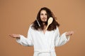 Unhappy Man Having Problem With Long Hair Detangling, Beige Background Royalty Free Stock Photo