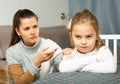 Unhappy young woman discuss conflict with small daughter