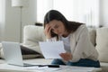 Unhappy young woman read bad news in bank post notice Royalty Free Stock Photo