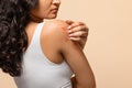 Unhappy young woman scratching her irritated skin on arm Royalty Free Stock Photo