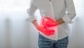 Unhealthy Asian woman hands touching her belly, Looking like stomach pain Royalty Free Stock Photo