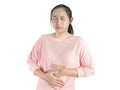 Unhealthy Asian woman suffering from stomachache and keeps hands on belly, Isolated on white background