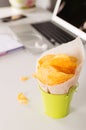 Unhealthy chips for snack at work. Food in the office Royalty Free Stock Photo