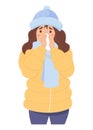 Unhealthy cold girl in winter clothes is frozen and wipes her nose with handkerchief. Season of sickness and cold