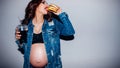 Unhealthy diet junk fast food pregnant woman Royalty Free Stock Photo