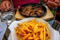 Unhealthy eating, pork steaks and french fries Royalty Free Stock Photo