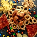 Unhealthy, Fast food concept. onion rings, pizza, french fries, bbq chicken, candy, chocolate, potato chips, salt Royalty Free Stock Photo