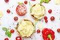 Unhealthy food background, potato chips with salt, tomatoes, chi