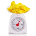 Unhealthy food on balance scale Royalty Free Stock Photo