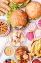Unhealthy food. Sweets and fast food top view flat lay
