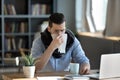 Unhealthy ill stressed young 30s businessman having first flu symptoms. Royalty Free Stock Photo