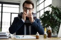 Unhealthy male employee suffer from flu at workplace