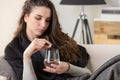 Unhealthy sick woman takes pill with glass of water