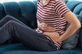 Unhealthy woman hands touching her belly, Looking like stomach pain Royalty Free Stock Photo