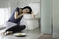 Unhealthy woman looks sleep in the bathroom