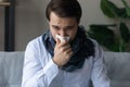 Unhealthy young man suffering from runny nose. Royalty Free Stock Photo