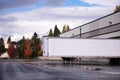 Dry van semi trailer loading and unloading in warehouse dock gates Royalty Free Stock Photo