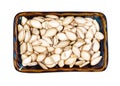 Unhusked Pumpkin seeds in rectangular bowl cutout