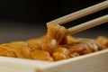 Uni sushi in chopsticks. Sea urchinuni sashimi ,Japanese food