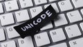 Unicode Encoding Standard Concept with Black Paper Note on Computer Keyboard Keys for Programming and Global Communication Royalty Free Stock Photo