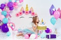 Unicorn Girl posing near happy birthday cake. Idea for decoratin Royalty Free Stock Photo
