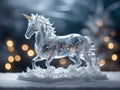 unicorn ice sculpture transparent decorative object on snow and christmas lights blur winter wonderland