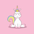 A unicorn sits with a rainbow tail