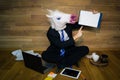 Unicorn in a suit and tie smiles and shows his finger on a a white empty sheet with copy space