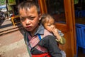 Unidenti Unidentified Hmong Boy Carrying Baby in Sapa, Lao Cai,Vietnam