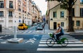 Unidentifiable man cycling down the street. The public bike system in Paris Royalty Free Stock Photo