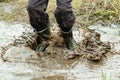 Unidentifiable person jumping in muddy water Royalty Free Stock Photo