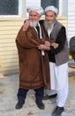 Unidentified Afghan Men in traditional Outfit holding each other in Ovakent, Hatay, Turkey