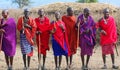 Unidentified African people from Masai tribe prepare to show