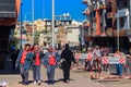 Unidentified arabic schoolgirls dressed in school uniform and traditional muslim hijab walking on city street