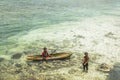 Unidentified Bajau Laut kids on a boat in Maiga Island Royalty Free Stock Photo