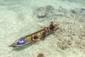 Unidentified Bajau Laut kids on a boat in Maiga Island Royalty Free Stock Photo