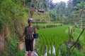 An unidentified Balinese women rice farmer poses during a morning`s work near Ubud, Bali, Indonesia, 09.08.2018