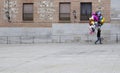 Unidentified balloon seller walks the old town street on Madrid