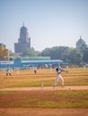 Unidentified batsman playing aggressive shot during cricket match in South Mumbai