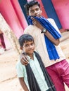 Unidentified best children boys friends smiling standing with hand on shoulder enjoying friendship