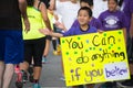 Unidentified boy with poster participating in the 30th LA Marathon Edition