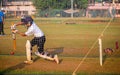 Unidentified boy practicing batting to improve cricketing skills at Mumbai ground Royalty Free Stock Photo