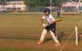 Unidentified boy practicing batting to improve cricketing skills at Mumbai ground Royalty Free Stock Photo