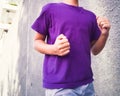 Unidentified boy running and jogging with concrete background