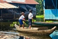 An unidentified boys on a boat floating on Tonle Sap lake Royalty Free Stock Photo