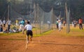 Unidentified boys practicing batting & bowling to improve cricketing skills at Mumbai ground Royalty Free Stock Photo