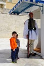 Unidentified boys taking pictures with Greek soldiers in Athens