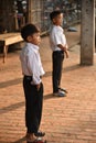 Unidentified boys waiting to go to school Royalty Free Stock Photo