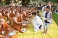 Unidentified Buddhist monks are given food offering from people at Mahabodhi temple Bodh Gaya